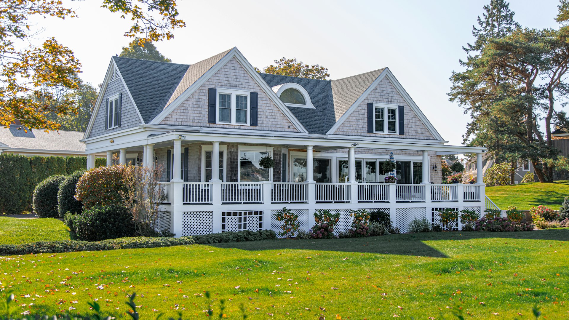 Freshly washed white home with a wraparound porch in Marrero, Louisiana