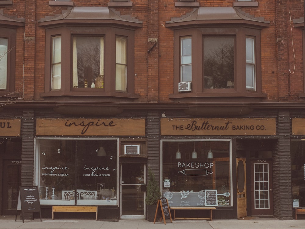 Row of brick storefronts with a clean sidewalk out front