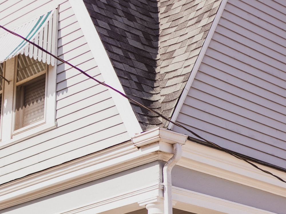 Gutter line, siding and window trim brightened back to white